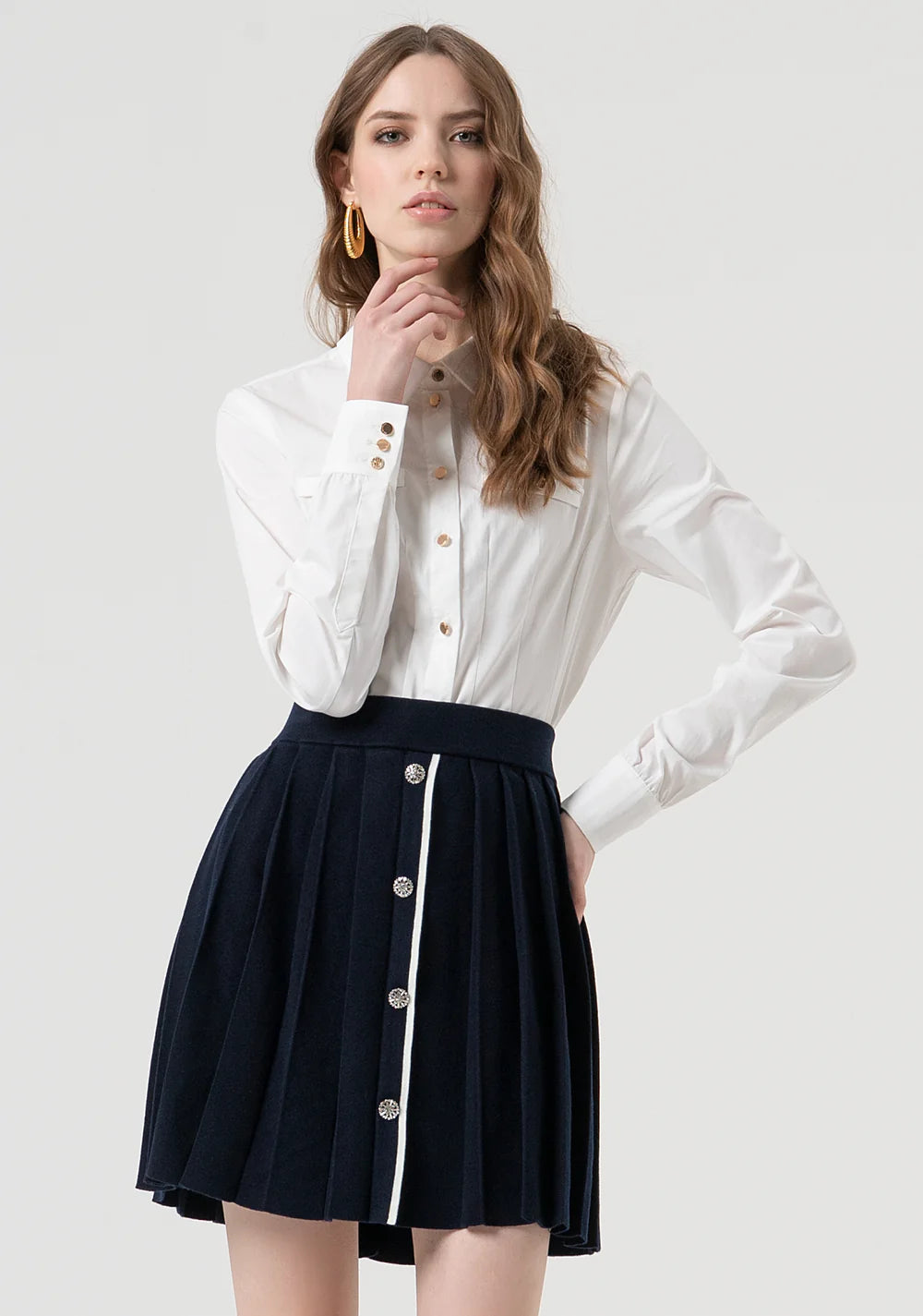 Mini saia de malha evasê com efeito plissado Fracomina